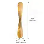Wooden floor lamp with warm glow in a cozy living room