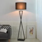 Modern floor lamp with iron frame and fabric shade in a contemporary living room