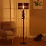 Modern crystal floor lamp with black finish and LED light in a living room