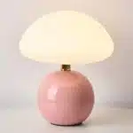 Mushroom table lamp with cream ceramic shade on bedside table