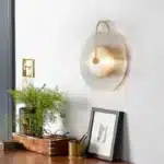 Modern wall lamp with minimalist Nordic design illuminating a cozy bedroom bedside