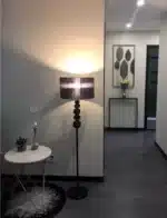 Modern crystal floor lamp with black finish and LED light in a living room