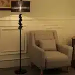Modern crystal floor lamp with black finish and LED light in a living room