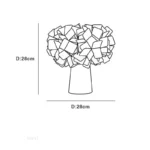 Modern table lamp with PVC flower design in a cozy bedroom setting