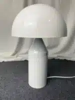 Modern mushroom table lamp with metal shade and wood base on bedside table