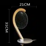 3D LED table lamp with wooden base and acrylic art glowing in a cozy room