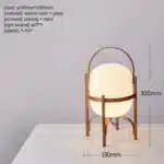 Modern table lamp with wood and glass base, minimalist design for bedroom or living room