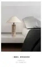 Modern marble LED table lamp with white fabric shade on wooden desk