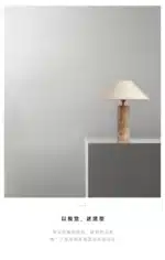 Modern marble LED table lamp with white fabric shade on wooden desk