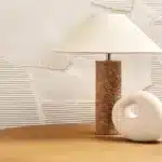 Modern marble LED table lamp with white fabric shade on wooden desk