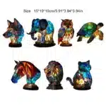 Colorful stained glass animal lamp featuring a cat design, glowing warmly on a bedside table