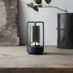Modern USB table lamp with charging port on a wooden desk