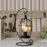 Vintage table lamp with hanging lantern and candlestick design, metal hollow lanterns for warm ambient lighting
