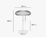 White glass table lamp with vintage design on a wooden desk in a cozy bedroom