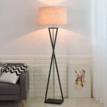 Modern floor lamp with iron frame and fabric shade in a contemporary living room