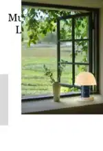Nordic retro mushroom table lamp with warm LED glow on a bedside table