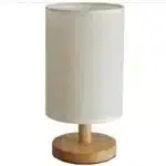 Modern linen table lamp with USB port and touch control on bedside table