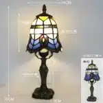 Tiffany table lamp with colorful stained glass shade casting warm glow on nightstand