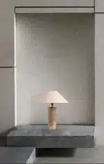 Modern marble LED table lamp with white fabric shade on wooden desk