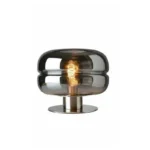 Modern table lamp with glass shade on bedside table
