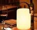 Cordless table lamp with RGB LED lighting on a patio table