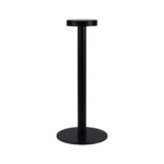 Modern rechargeable table lamp glowing warmly on a wooden bedside table