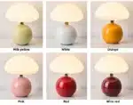 Mushroom table lamp with cream ceramic shade on bedside table
