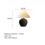 Wabi sabi table lamp with textured ceramic base and linen shade in a cozy living room