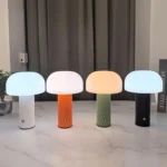 Modern mushroom table lamp with warm glow on wooden table
