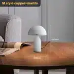 Elegant marble table lamp with soft glow on bedside table in bedroom