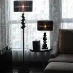 Modern crystal floor lamp with black finish and LED light in a living room
