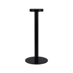 Modern rechargeable table lamp glowing warmly on a wooden bedside table