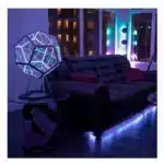 Dodecahedron gaming light with vibrant RGBW colors illuminating a gaming desk setup