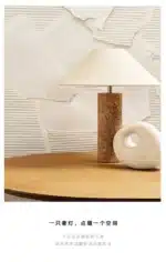 Modern marble LED table lamp with white fabric shade on wooden desk