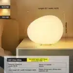 Modern table lamp with warm glow on bedside table