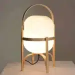 Modern table lamp with wood and glass base, minimalist design for bedroom or living room