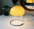 Modern table lamp with mushroom shade in a cozy bedroom