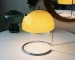 Modern table lamp with mushroom shade in a cozy bedroom