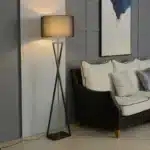 Modern floor lamp with iron frame and fabric shade in a contemporary living room