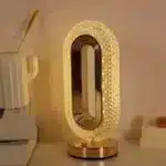 Elegant oval crystal table lamp with USB charging on a bedside table
