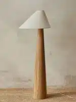 Conical oak floor lamp with wabi-sabi style in a cozy living room