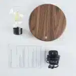 Floating LED lamp with levitating bulb on a wooden desk in a modern living room