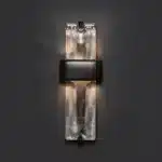 Rustic wall sconce with Edison bulb illuminating a modern loft bedroom