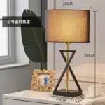 Modern floor lamp with iron frame and fabric shade in a contemporary living room