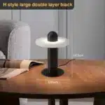 Elegant marble table lamp with soft glow on bedside table in bedroom