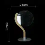 3D LED table lamp with wooden base and acrylic art glowing in a cozy room