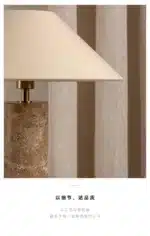 Modern marble LED table lamp with white fabric shade on wooden desk