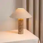 Modern marble LED table lamp with white fabric shade on wooden desk
