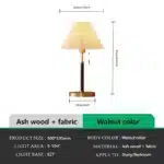 Retro desk lamp with black metal base and pleated fabric shade in warm glow