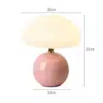 Mushroom table lamp with cream ceramic shade on bedside table